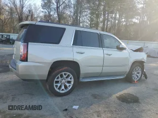 2015 GMC Yukon SLE with VIN 1GKS1AKC4FR265208, listed as a Copart auction lot 42324245 with 105,760 mi miles and Salvage Title. Bid and sale history available at carsss.com. Image 3.