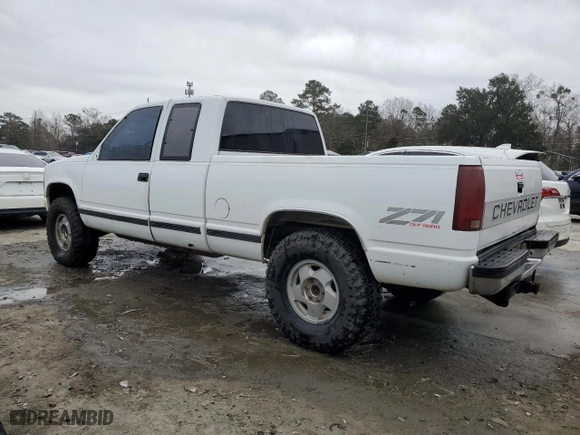 1990 Chevrolet C/K 2500 with VIN 2GCFK29K5L1177737, listed as a Copart auction lot 43911515 with 329,501 mi miles and Salvage Title. Bid and sale history available at carsss.com. Image 2.