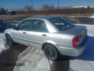 2002 Mazda Protege DX with VIN JM1BJ225321588015, listed as a IAAI auction lot 41409015 with 170,815 mi miles and . Bid and sale history available at DreamBid. Image 3.