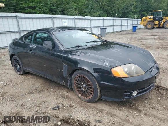 2003 Hyundai Tiburon GT z VIN KMHHN65F83U101784, wystawiony jako Copart lot #41566805 z przebiegiem 99 970 mil mil oraz Nie do naprawy • Non repairable. Historia ofert i sprzedaży dostępna na DreamBid. Obrazek 4.