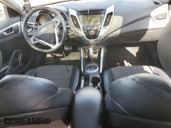 2013 Hyundai Veloster w/Gray Int z VIN KMHTC6ADXDU127194, wystawiony jako Copart lot #51751345 z przebiegiem 122 221 mil mil oraz Szkoda całkowita • Salvage title. Historia ofert i sprzedaży dostępna na DreamBid. Obrazek 8.