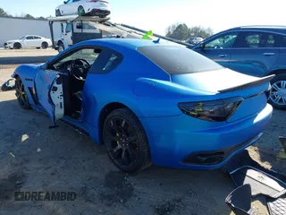 2013 Maserati GranTurismo Sport with VIN ZAM45VLA5D0070499, listed as a IAAI auction lot 41284315 with 50,156 mi miles. Bid and sale history available at carsss.com. Image 3.