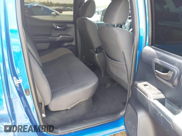 2018 Toyota Tacoma SR5 z VIN 5TFAZ5CN2JX064452, wystawiony jako IAAI lot #41945468 z przebiegiem 132 450 mil mil oraz . Historia ofert i sprzedaży dostępna na DreamBid. Obrazek 8.