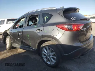 2014 Mazda CX-5 Grand Touring with VIN JM3KE4DY1E0328852, listed as a Copart auction lot 53965265 with 67,242 mi miles and Salvage Title. Bid and sale history available at DreamBid. Image 2.