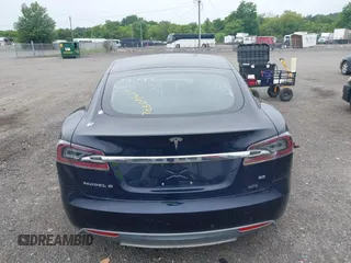 2014 Tesla Model S 60 with VIN 5YJSA1H19EFP32063, listed as a IAAI auction lot 42360872 with 103,495 mi miles and . Bid and sale history available at DreamBid. Image 16.