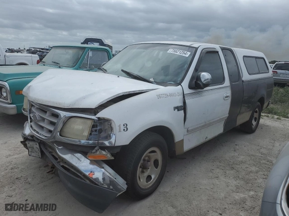 1999 Ford F-150 Work Series with VIN 1FTRX17W0XNA86913, listed as a Copart auction lot 75621254 with 0 mi miles and Salvage Title. Bid and sale history available at carsss.com. Image 1.