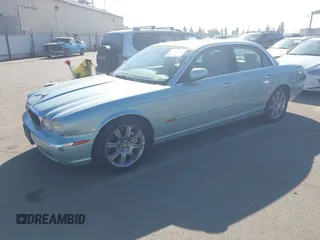 2004 Jaguar XJ 8 with VIN SAJEA71CX4SG10751, listed as a IAAI auction lot 42149348 with 89,786 mi miles and . Bid and sale history available at DreamBid. Image 2.