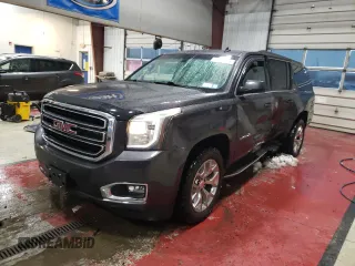 2015 GMC Yukon XL SLE with VIN 1GKS2GKC1FR258815, listed as a Copart auction lot 43360965 with 142,311 mi miles and Salvage Title. Bid and sale history available at carsss.com. Image 1.