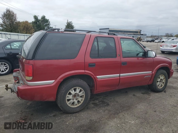 1999 GMC Jimmy SLE z VIN 1GKDT13W3X2546163, wystawiony jako Copart lot #79842734 z przebiegiem 144 800 mil mil oraz Szkoda całkowita • Salvage title. Historia ofert i sprzedaży dostępna na DreamBid. Obrazek 3.