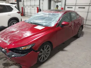 2022 Mazda Mazda3 Sedan Carbon Edition with VIN 3MZBPACL7NM310664, listed as a IAAI auction lot 41297956 with 61,467 mi miles. Bid and sale history available at carsss.com. Image 2.