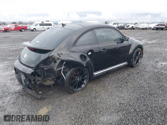 2014 Volkswagen Beetle 2.5L w/Sun with VIN 3VWJP7AT3EM608906, listed as a IAAI auction lot 41501830 with 42,804 mi miles and . Bid and sale history available at DreamBid. Image 4.