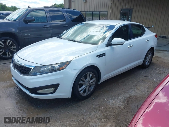 2013 Kia Optima LX z VIN 5XXGM4A7XDG197818, wystawiony jako IAAI lot #42340379 z przebiegiem 185 144 mil mil oraz . Historia ofert i sprzedaży dostępna na DreamBid. Obrazek 2.