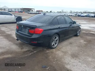 2014 BMW 3 Series 328i xDrive with VIN WBA3B3G57ENR82319, listed as a IAAI auction lot 41655950 with 130,926 mi miles. Bid and sale history available at carsss.com. Image 4.