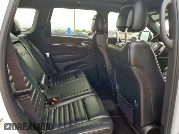 2018 Jeep Grand Cherokee Sterling z VIN 1C4RJEBG4JC322703, wystawiony jako Copart lot #60742505 z przebiegiem 110 621 mil mil oraz Szkoda całkowita • Salvage title. Historia ofert i sprzedaży dostępna na DreamBid. Obrazek 10.