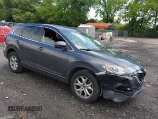 2015 Mazda CX-9 Sport with VIN JM3TB2BA7F0465822, listed as a IAAI auction lot 42270131 with 123,483 mi miles and . Bid and sale history available at DreamBid. Image 1.