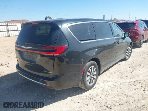 2023 Chrysler Pacifica Hybrid Touring L with VIN 2C4RC1L75PR611901, listed as a IAAI auction lot 41510935 with 44,156 mi miles and . Bid and sale history available at DreamBid. Image 4.