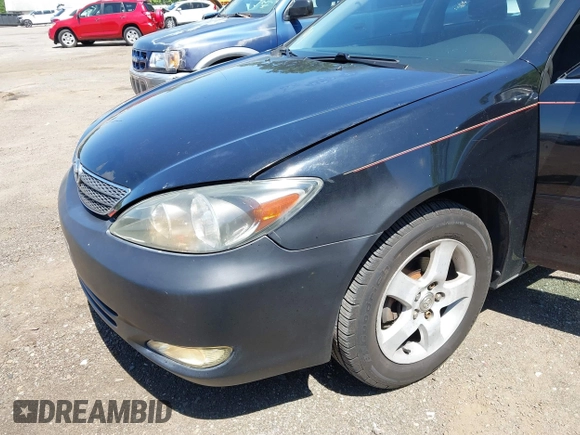 2002 Toyota Camry LE z VIN JTDBE32K020095947, wystawiony jako IAAI lot #42364984 z przebiegiem 198 756 mil mil oraz . Historia ofert i sprzedaży dostępna na DreamBid. Obrazek 6.