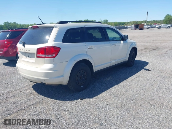 2014 Dodge Journey SE with VIN 3C4PDCAB9ET121415, listed as a IAAI auction lot 42138601 with 157,043 mi miles. Bid and sale history available at carsss.com. Image 4.