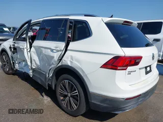 2018 Volkswagen Tiguan SEL z VIN 3VV3B7AX5JM091021, wystawiony jako IAAI lot #42392698 z przebiegiem 107 595 mil mil oraz . Historia ofert i sprzedaży dostępna na DreamBid. Obrazek 14.