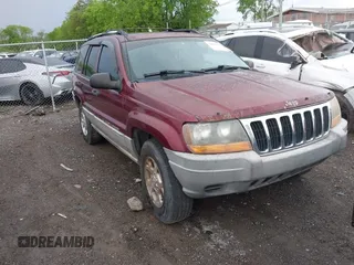 2000 Jeep Grand Cherokee Laredo z VIN 1J4GW48S5YC234942, wystawiony jako IAAI lot #42092378 z przebiegiem 235 168 mil mil oraz . Historia ofert i sprzedaży dostępna na DreamBid. Obrazek 1.