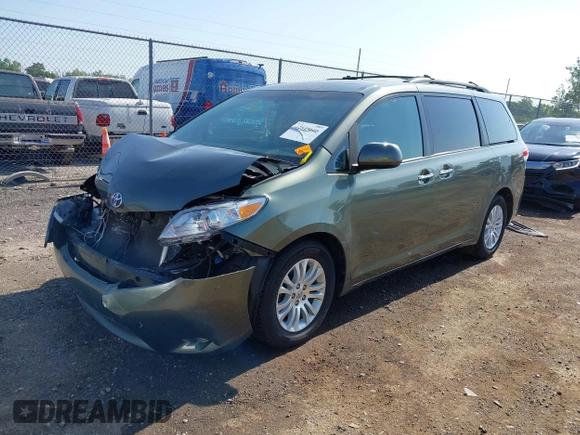 2014 Toyota Sienna XLE with VIN 5TDYK3DC6ES414892, listed as a IAAI auction lot 42545666 with 135,805 mi miles and . Bid and sale history available at DreamBid. Image 2.