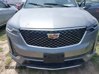 2024 Cadillac XT6 FWD Luxury z VIN 1GYKPAR48RZ747722, wystawiony jako IAAI lot #41923351 z przebiegiem Nie podano mil oraz . Historia ofert i sprzedaży dostępna na DreamBid. Obrazek 6.