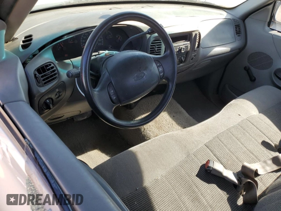 1998 Ford F-150 z VIN 1FTZF1762WKA87421, wystawiony jako Copart lot #86973334 z przebiegiem 217 978 mil mil oraz Szkoda całkowita • Salvage title. Historia ofert i sprzedaży dostępna na DreamBid. Obrazek 8.