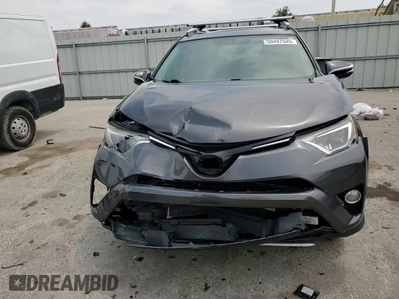 2016 Toyota RAV4 XLE with VIN 2T3RFREV0GW412875, listed as a Copart auction lot 59497545 with 226,604 mi miles and Salvage title. Bid and sale history available at DreamBid. Image 14.