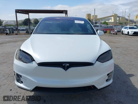 2021 Tesla Model X Long Range Plus with VIN 5YJXCBE23MF321243, listed as a IAAI auction lot 42100580 with 59,878 mi miles and . Bid and sale history available at carsss.com. Image 12.