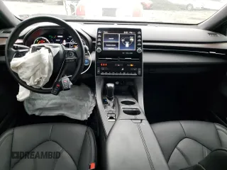 2021 Toyota Avalon Hybrid XLE z VIN 4T1AA1AB1MU003264, wystawiony jako Copart lot #73299832 z przebiegiem 107 735 mil mil oraz . Historia ofert i sprzedaży dostępna na DreamBid. Obrazek 8.