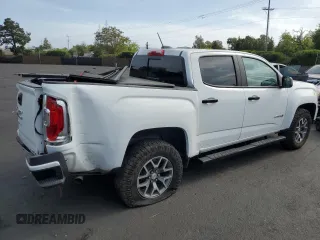 2022 GMC Canyon 4WD AT4 z VIN 1GTG6FEN0N1164841, wystawiony jako Copart lot #54440155 z przebiegiem 31 658 mil mil oraz Szkoda całkowita • Salvage title. Historia ofert i sprzedaży dostępna na DreamBid. Obrazek 3.
