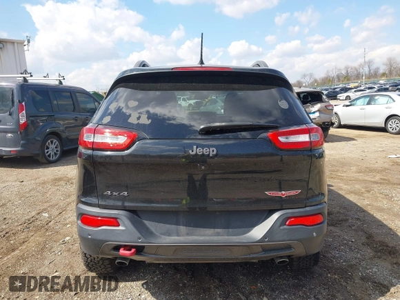 2014 Jeep Cherokee Trailhawk with VIN 1C4PJMBS6EW100500, listed as a IAAI auction lot 41894989 with 131,034 mi miles. Bid and sale history available at carsss.com. Image 16.