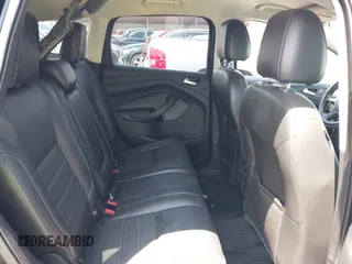 2014 Ford Escape SE z VIN 1FMCU0G96EUD57930, wystawiony jako IAAI lot #42347567 z przebiegiem 169 128 mil mil oraz . Historia ofert i sprzedaży dostępna na DreamBid. Obrazek 8.