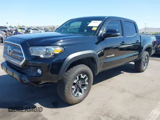 2016 Toyota Tacoma SR with VIN 3TMCZ5AN3GM019210, listed as a IAAI auction lot 42003617 with 171,581 mi miles. Bid and sale history available at carsss.com. Image 2.