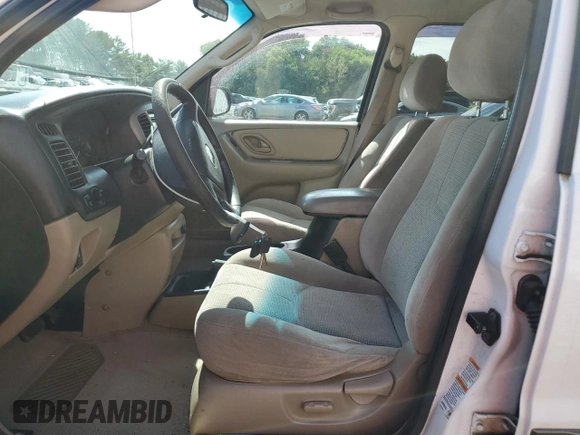 2003 Mazda Tribute LX with VIN 4F2CZ94133KM19916, listed as a Copart auction lot 73718284 with 151,644 mi miles and Salvage Title. Bid and sale history available at DreamBid. Image 7.