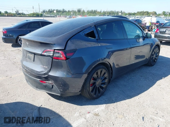 2022 Tesla Model Y Performance with VIN 7SAYGDEF6NF540094, listed as a IAAI auction lot 41786865 with 28,356 mi miles and . Bid and sale history available at DreamBid. Image 4.