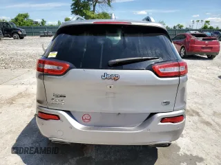 2016 Jeep Cherokee Overland z VIN 1C4PJMJSXGW300719, wystawiony jako Copart lot #58216665 z przebiegiem 128 016 mil mil oraz Szkoda całkowita • Salvage title. Historia ofert i sprzedaży dostępna na DreamBid. Obrazek 6.