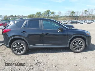 2016 Mazda CX-5 Grand Touring with VIN JM3KE4DY8G0639570, listed as a IAAI auction lot 42098512 with 126,541 mi miles and . Bid and sale history available at carsss.com. Image 13.
