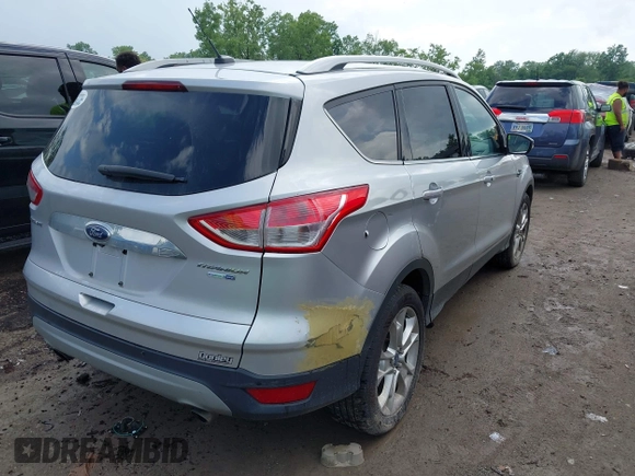 2016 Ford Escape Titanium with VIN 1FMCU9J95GUB93585, listed as a IAAI auction lot 42614106 with 124,465 mi miles and . Bid and sale history available at DreamBid. Image 4.