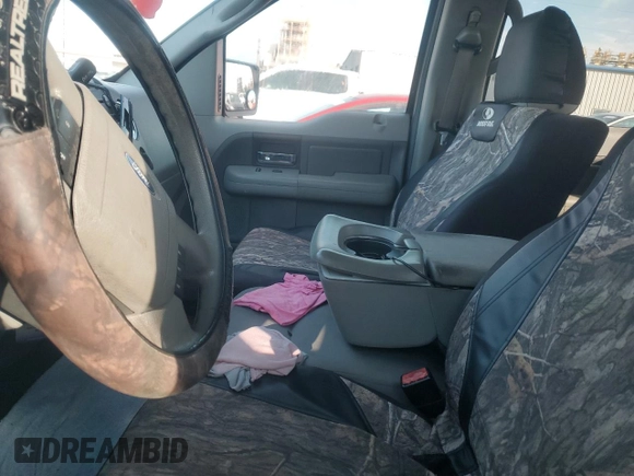 2007 Ford F-150 XLT with VIN 1FTRW12W17KB14777, listed as a Copart auction lot 56724275 with 187,114 mi miles and Salvage title. Bid and sale history available at DreamBid. Image 7.