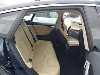 2014 Tesla Model S 60 with VIN 5YJSA1H10EFP30234, listed as a IAAI auction lot 42182249 with 186,654 mi miles and . Bid and sale history available at DreamBid. Image 8.