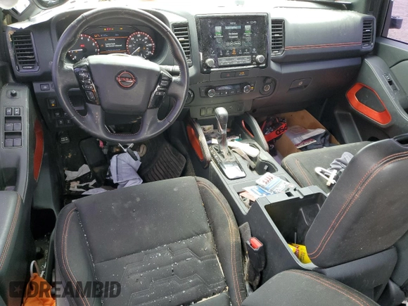 2023 Nissan Frontier Pro-4X with VIN 1N6ED1EK0PN617872, listed as a Copart auction lot 57125435 with 97,981 mi miles and Salvage title. Bid and sale history available at DreamBid. Image 8.
