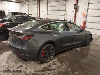2020 Tesla Model 3 Performance with VIN 5YJ3E1EC3LF641768, listed as a IAAI auction lot 41542615 with 43,343 mi miles. Bid and sale history available at carsss.com. Image 4.