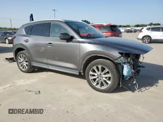 2019 Mazda CX-5 Grand Touring with VIN JM3KFADM8K1634011, listed as a Copart auction lot 57343455 with 67,138 mi miles and Salvage title. Bid and sale history available at DreamBid. Image 4.