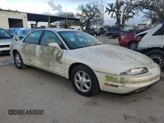 1999 Oldsmobile Aurora with VIN 1G3GR62C2X4107973, listed as a Copart auction lot 84023124 with 80,402 mi miles and Non Repairable. Bid and sale history available at DreamBid. Image 4.