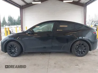2023 Tesla Model Y Long Range with VIN 7SAYGAEEXPF707503, listed as a IAAI auction lot 41712166 with 27,467 mi miles and . Bid and sale history available at carsss.com. Image 14.