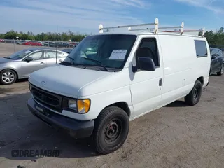 2001 Ford Econoline Cargo with VIN 1FTRE14291HA84414, listed as a IAAI auction lot 41463623 with 192,835 mi miles. Bid and sale history available at carsss.com. Image 2.