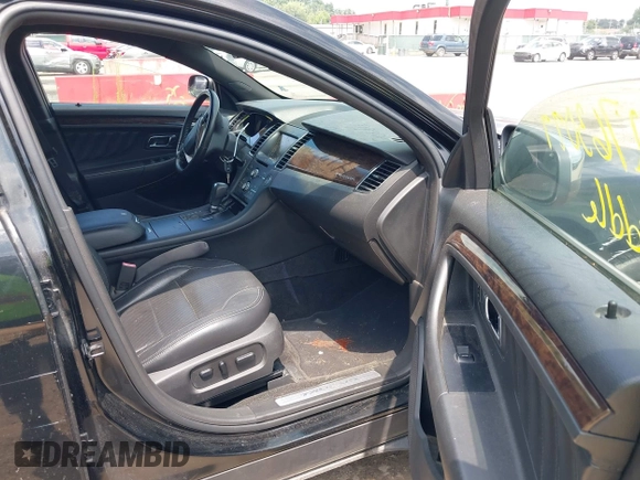 2013 Ford Taurus Limited z VIN 1FAHP2F85DG103747, wystawiony jako IAAI lot #42763099 z przebiegiem 181 891 mil mil oraz . Historia ofert i sprzedaży dostępna na DreamBid. Obrazek 5.