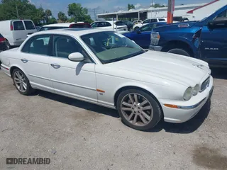 2004 Jaguar XJ with VIN SAJWA73BX4TG14270, listed as a IAAI auction lot 41905325 with 104,908 mi miles. Bid and sale history available at carsss.com. Image 1.