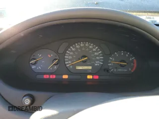 2000 Mitsubishi Galant LS with VIN 4A3AA56LXYE174881, listed as a Copart auction lot 79727154 with 106,001 mi miles and Salvage Title. Bid and sale history available at carsss.com. Image 9.